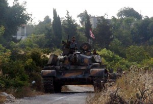 543494-un-char-de-l-armee-syrienne-positionne-dans-la-region-de-lattaquie-sur-une-photo-de-l-agence-syrienn