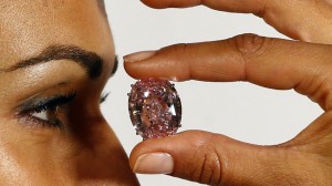 File photo of model displaying 'Pink Star' 59.60 carat oval cut pink diamond at Sotheby's in Geneva