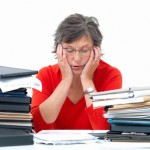 Overworked woman stressed with work